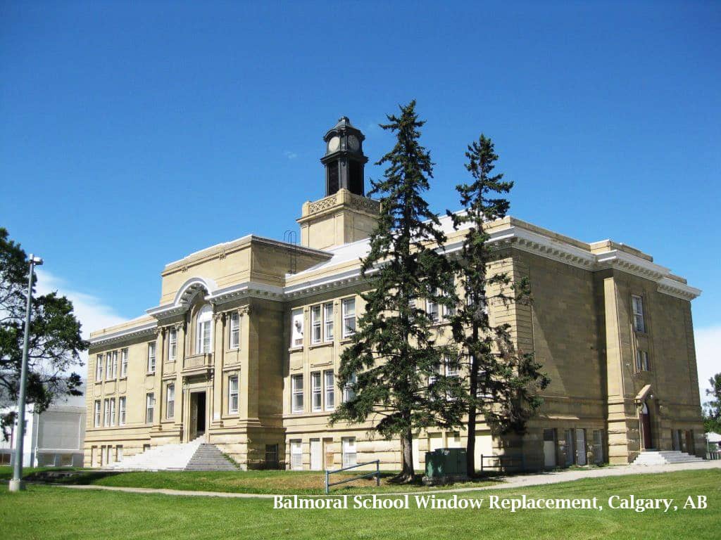 a large stone statue in front of a building