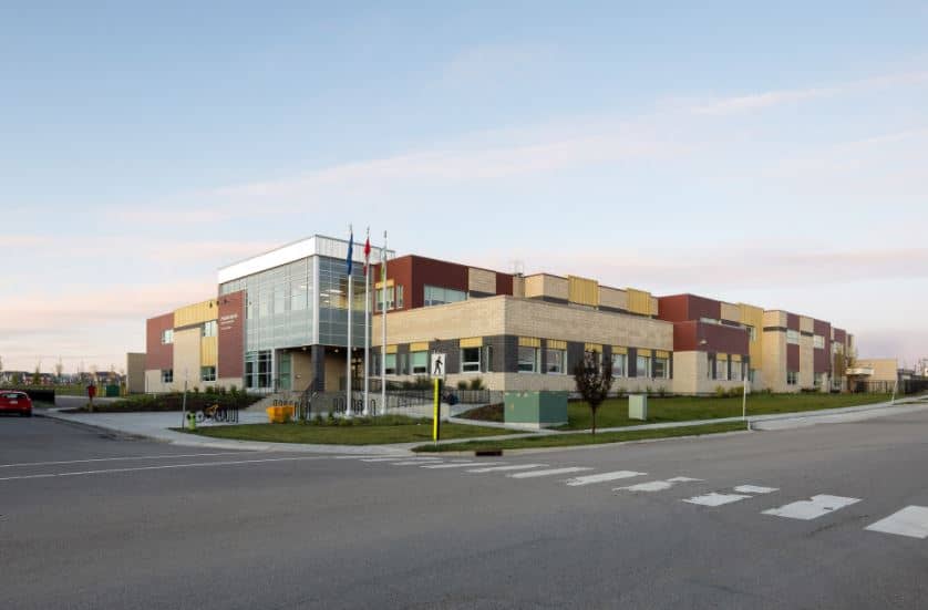 an empty road with a building in the background