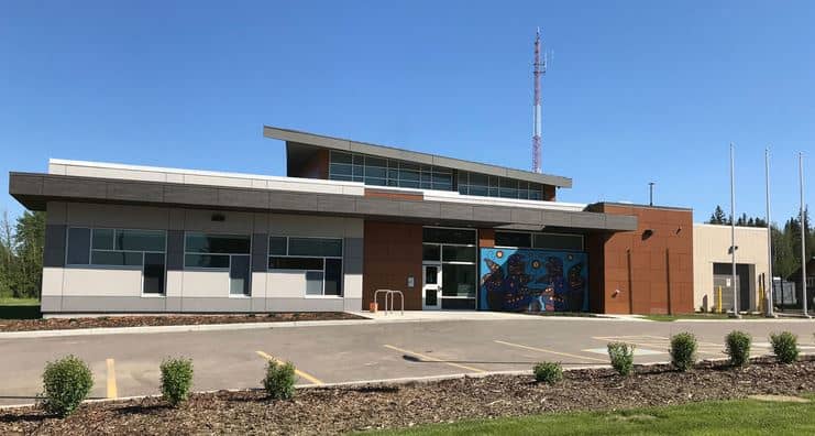 a house that has a sign on the side of a building