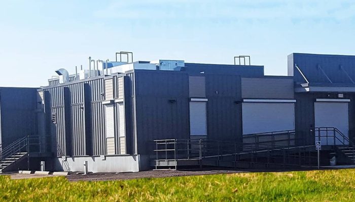 a building next to a fence